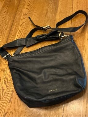 Woman’s Ted Baker London black leather shoulder/crossbody bag. Like new! Cute!